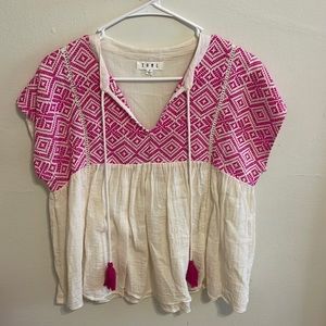 Off white and hot pink embroidered top.